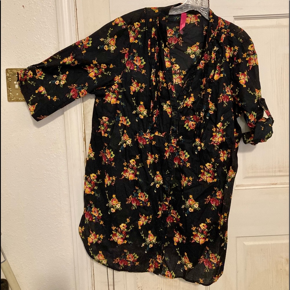 Rose print top is cotton with roll or not sleeves.